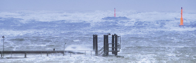 Stormy sea with beacons